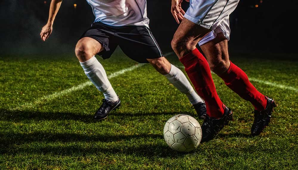 Two soccer players with ball