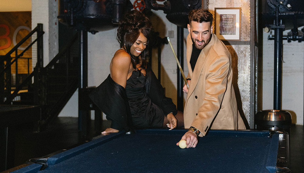 Couple playing pool