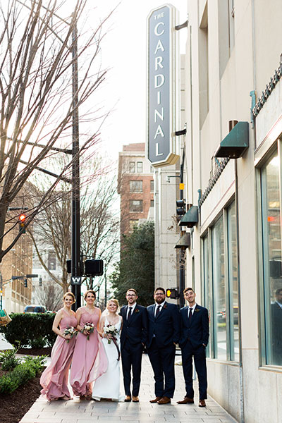 Bridal Party Outside with Sign