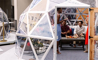 Igloo with people eating at table