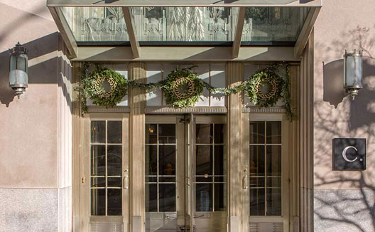 Holiday wreaths adorn the front entrance to the Cardinal